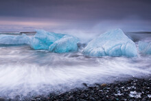 Glacial Ice From BreiÃ°amerkurjÃ¶kull Sits On The Beach  Of The Coast At BreiÃ°amerkursandur, Iceland, Also Known As The Jokulsarlon.
