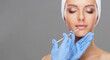© Acronym - Doctor injecting in a beautiful face of a young woman. Plastic surgery concept.