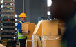 © Wosunan - Head of worker in an auto parts warehouse, Examine auto parts that are ready to be shipped to the automobile assembly factory.