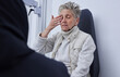© Courtney H/peopleimages.com - Senior woman, ophthalmology and eye pain with hand in clinic consultation for vision, wellness or health. Elderly patient, explain problem and talk with doctor for eyes, headache or medical solution