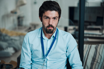 Technician, programmer and portrait of a man in a office for engineering service, maintenance or repairs. Information technology, professional and serious male IT engineer working in a workshop.