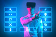 man with vr glasses is in virtual life and look up to virtual dashboard with options and icons to chose from make decision and start to play virtual game in augmented reality