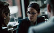 Young determined Business woman wearing a suit and glasses, having a discussion in an office environment. Artistic look and shallow depth of field. Not a real person, Illustrative, Generative AI.
