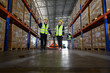 © Wosunan - Worker in auto parts warehouse use a handcart to work to bring the box of auto parts into the storage shelf of the warehouse waiting for delivery to the car assembly line