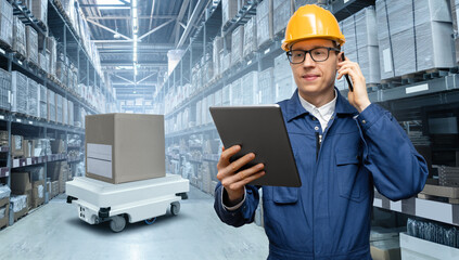 Poster - Manager with digital tablet and phone in an automated warehouse with robots