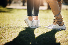 Shoes, Grass And Love With A Couple Outdoor Together, Kissing For Romance, Dating Or Affection In Summer. Nature, Field Or Feet With A Man And Woman On A Romantic Date For Relationship Bonding