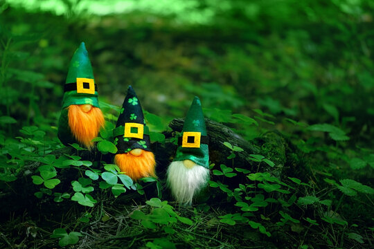 toy irish gnomes in mystery forest, abstract green natural background. magic friends dwarfs and fant