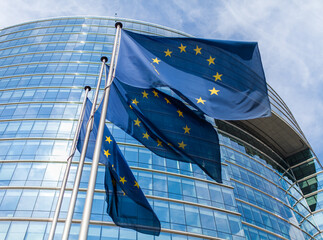 european union flags in front of the office building in brussels, belgium
