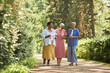 © Seventyfour - Group of cheerful senior women walking towards camera in park and enjoying summer