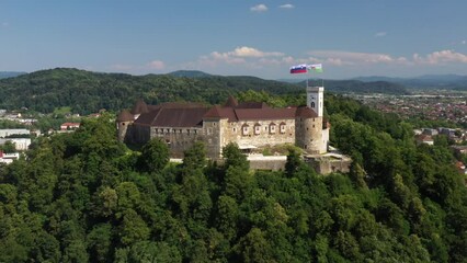 Wall Mural - Ljubljana Castle and old town in Slovenia. Ljubljana is the largest city. It's known for its university population and green spaces, including expansive Tivoli Park. The curving Ljubljanica River