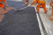 Asphalting Of A New Road On A Construction Site Housing Construc