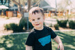 little toddler boy looking at the camera wearing a montana t-shirt
