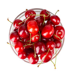 Wall Mural - Ripe red cherries. Bowl full of sweet cherries on isolated white background. File contains clipping path.