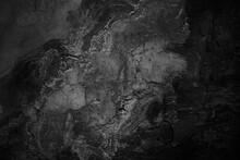 Black White Grunge Background For Design. Old Rough Concrete Wall With Cracks. Close-up. Dark Gray Distressed Texture. Crushed, Broken, Damaged Surface.