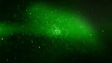 Green Particle Atmosphere With Orange Confetti 4K Loop Features Snow And Glitter Particles Flying Toward The Viewer In A Deep Green Atmosphere In A Loop.