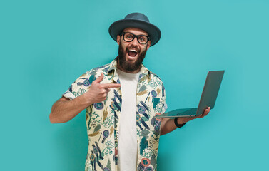 young crazy bearded charismatic man. shocked or surprised expression. laptop concept. funny promotio