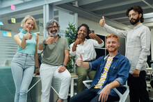 Portrait Of A Team Of Multiracial Professionals Confidently Giving The Ok, Young And Mature Colleagues Looking At The Camera With Smiling Face. Group Of Office Workers Of A Start-up Company.