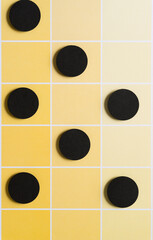 Sticker - black paper circles on yellow paper pad sheet with paint-chip pattern and coloration