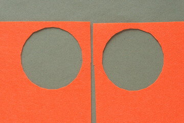 Sticker - two orange felt frame with circle cutouts on rough green paper