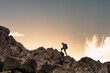 silhouette of a person up to the mountain top. Success, sport , and adventure connect. 