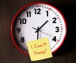 Clock on wallpaper point to after midnight with handwritten note I CAN'T SLEEP, concept of insomnia or sleep deprived, when one have trouble sleeping or struggle to fall asleep at night