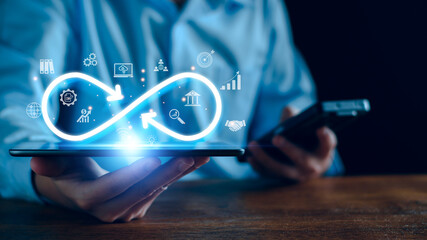 Wall Mural - technology infinity data link concept, businessman hands holding virtual infinity with technology ma
