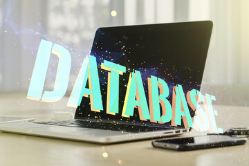 Wall Mural - double exposure of database word sign on laptop background, global research and analytics concept
