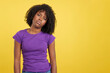 Woman with African hair standing in discomfort