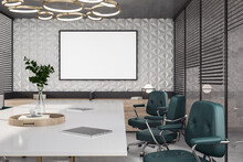 Blank White Poster In Black Frame With Space For Your Logo Or Text On Figure Grey Wall Background In Conference Room With Green Wheel Chairs Near Light Meeting Table With Digital Tablets. 3D Rendering