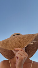 Young Pretty Woman Hide Face With Straw Hat