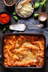 Wall Mural - portion of Lasagna in baking dish, top view