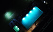 Aerial view of the hotel's illuminated night pool.
