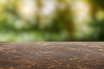 Brown wooden brown marble table and blurry green natural background. Copy space. Template. Illustration.