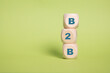 B2B,Business to Business Acronym on wooden blocks isolated on Green, copy space.