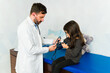 © AntonioDiaz - Doctor doing a medical examination on a little patient