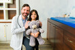 © AntonioDiaz - Portrait of a happy pediatrician with a kid patient
