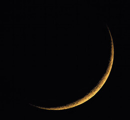 Wall Mural - crescent moon rising in the evening, new orange moon