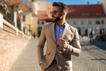 Sexy Bearded Man With Sunglasses Looking To Side And Posing