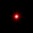 © DENYS - The red light of a star glowing from the darkness.
