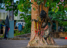 Statues Near A Tree In Thailand