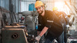 © NewSaetiew - Industrial engineers inspect and perform maintenance on the machines at factory machines. Worker checking and repair machine.