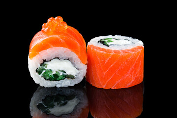 Poster - Sushi rolls Philadelphia with salmon, cream cheese, cucumber and red caviar on black.