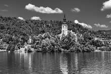 Bled, Slovenia: Beautiful Iconic Landscape Of Lake Bled And The Church Island In The Middle Of The Lake With Reflection On The Water Surface In Black And White