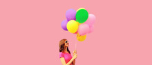 Summer Colorful Image Of Happy Smiling Young Woman Looking Up With Multicolor Balloons Looking Up At Copy Space On Pink Background