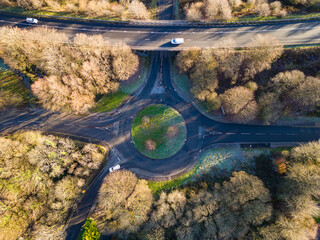 Wall Mural - Aerial view of a small traffic roundabout in winter