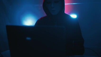 Wall Mural - hacker is working on laptop at night. hands are typing a virus code at keyboard or hacking website. 