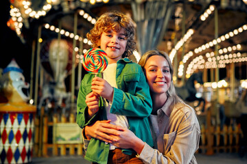 Kids having fun on a carnival Carousel