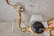 Home's main water line, meter, shutoff valve and copper grounding wire with clamp