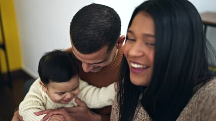 Wall Mural - Couple and son having video call sitting on sofa at home