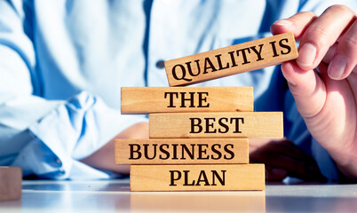 Wooden blocks with words 'Quality is the best business plan'.
